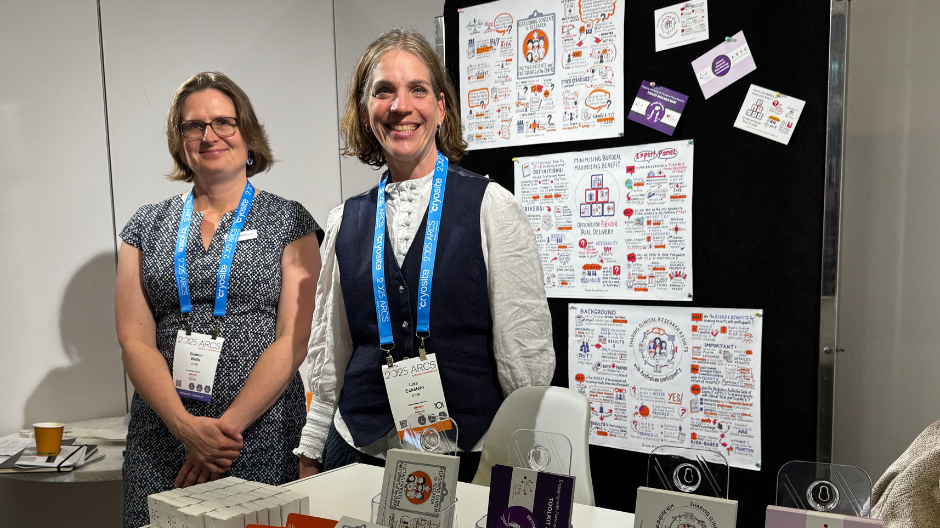 Gudrun and Lisa at a conference booth